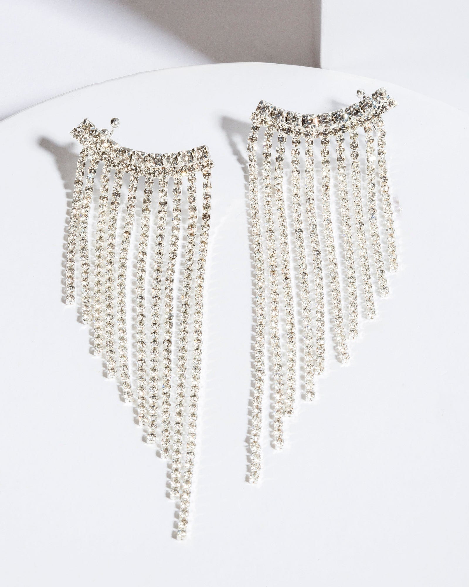 Curved drop store earrings