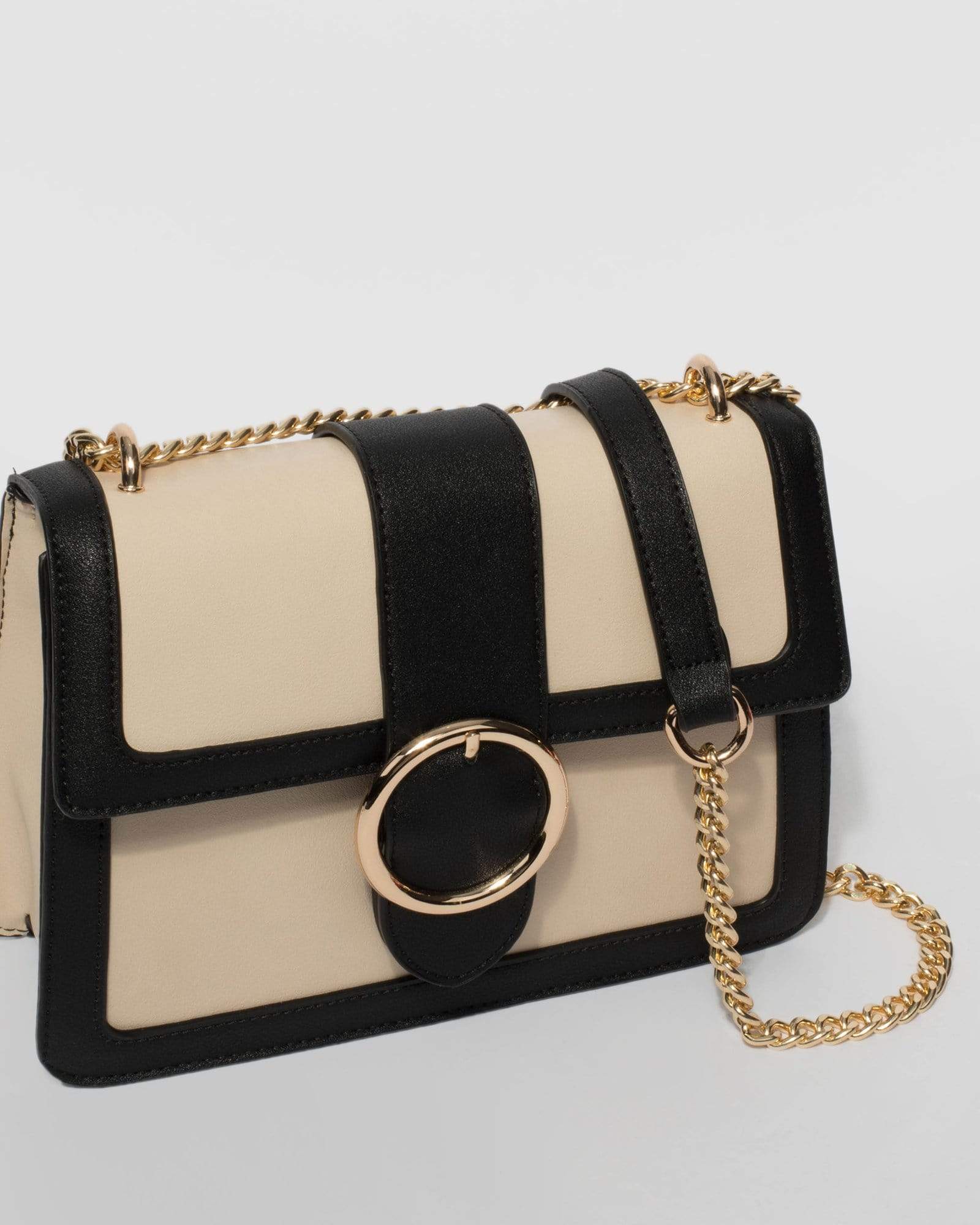 Circular buckle crossbody on sale bag