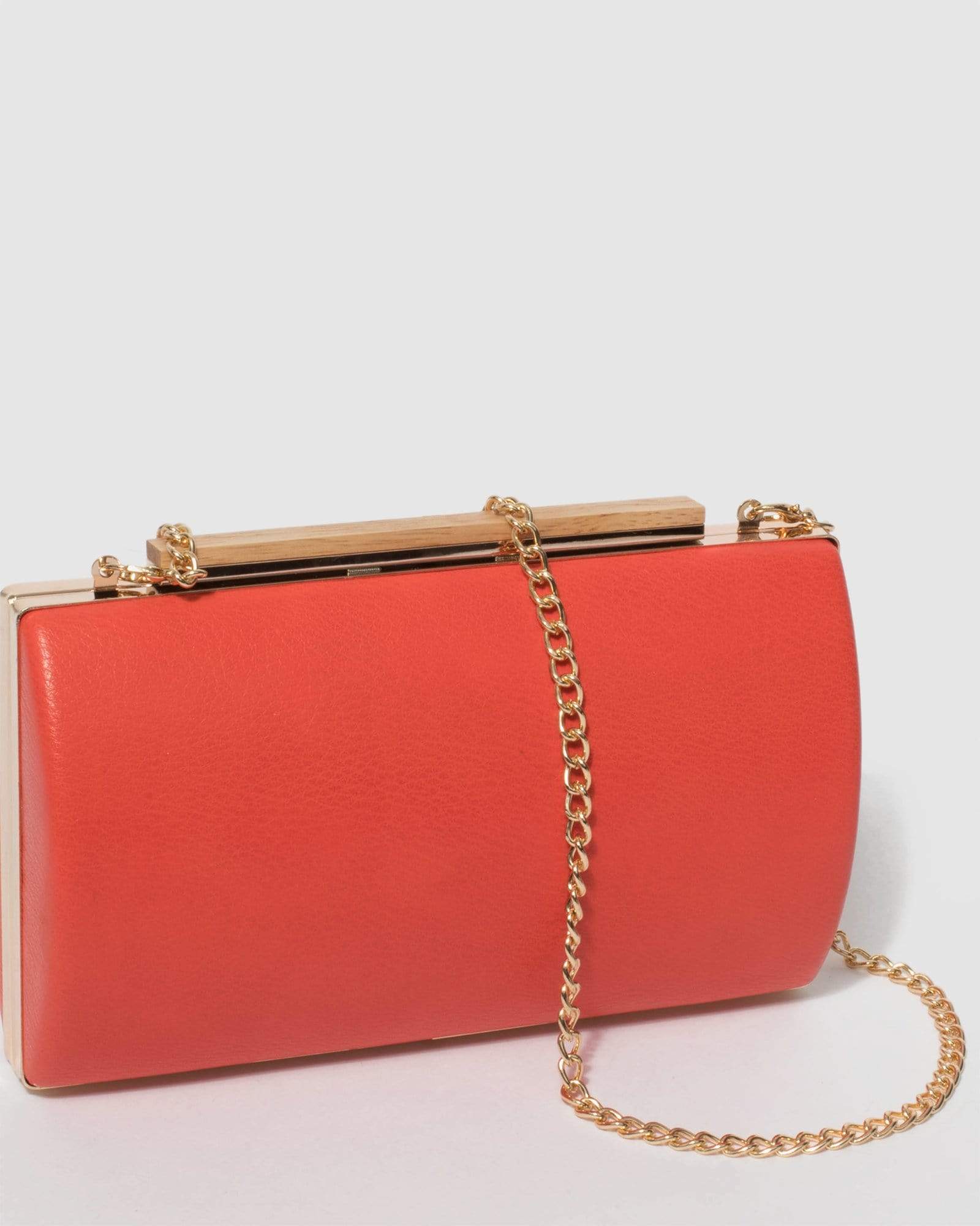 Coral on sale clutch bag